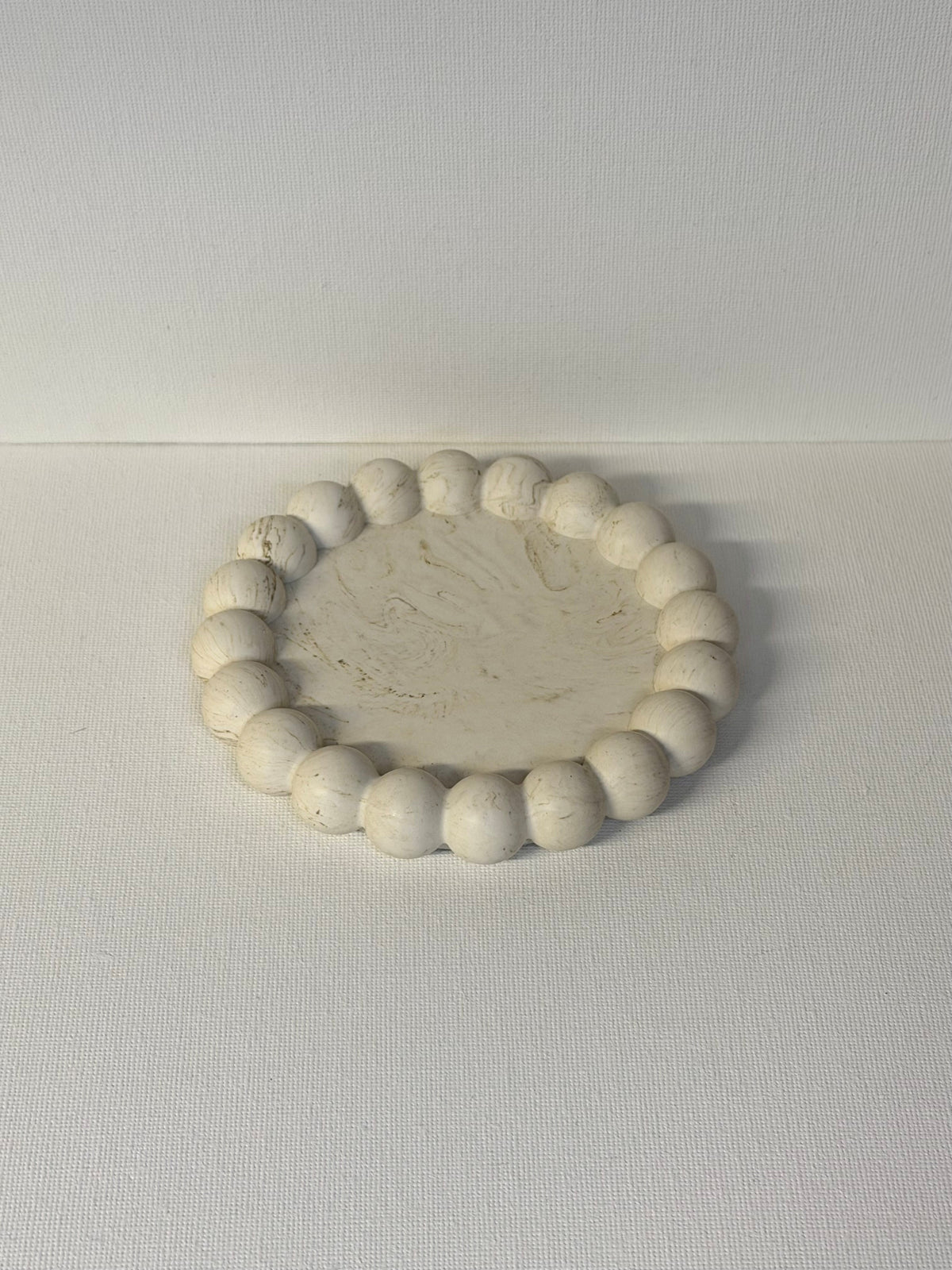 Candle tray with small bubbles