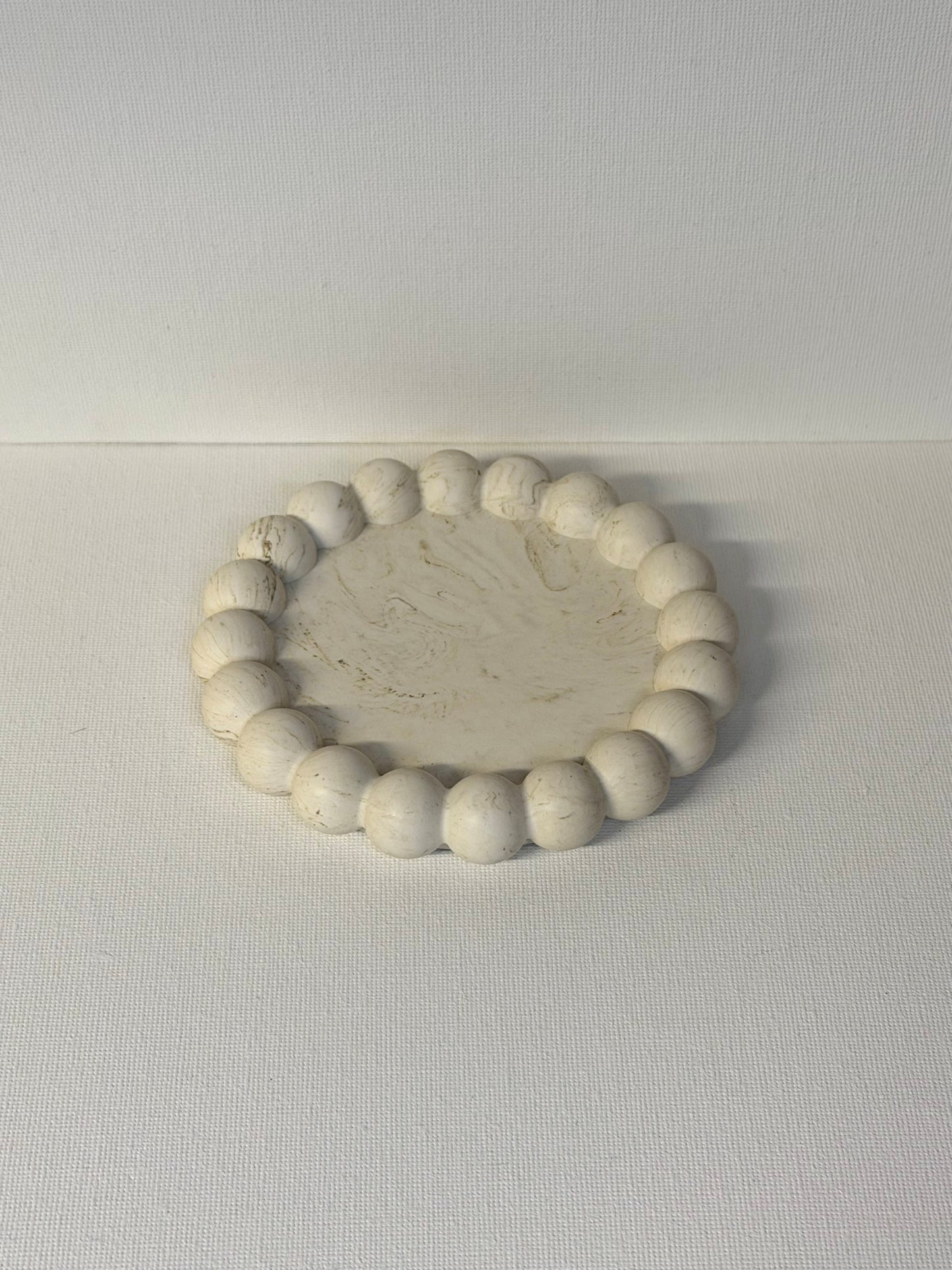 Candle tray with small bubbles