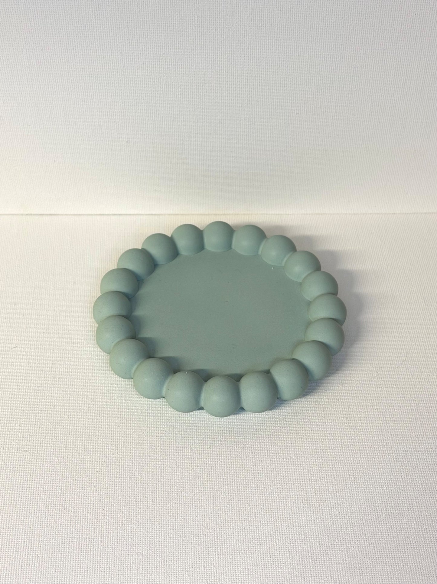 Candle tray with small bubbles